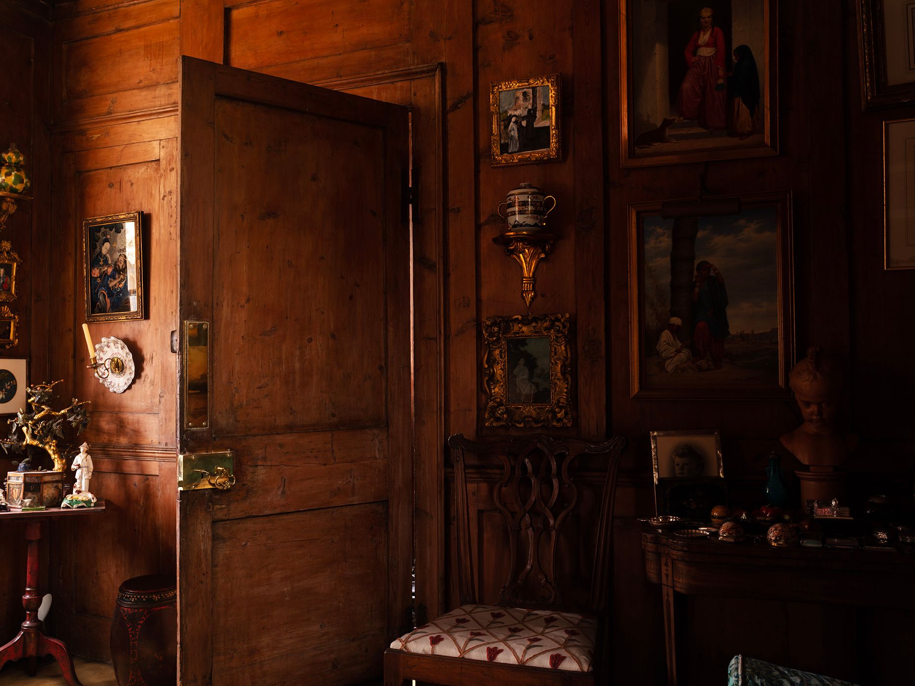 The woodpanelled jewel boxlike drawing room. Panels around the door would originally have folded out onto the landing to...