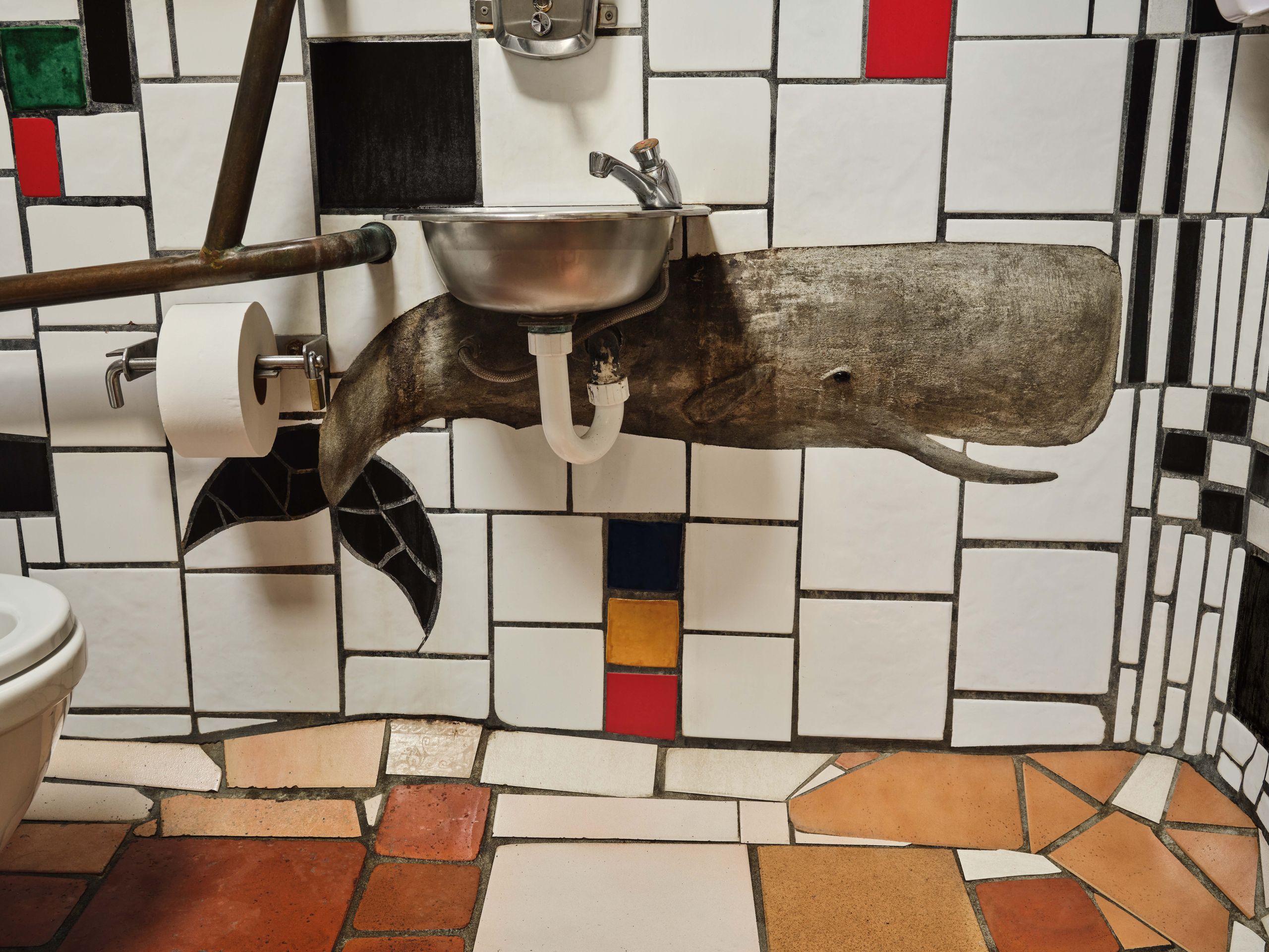 Tourists using the Kawakawa public loos are confronted by many startling sights  not least this relief in one of the...