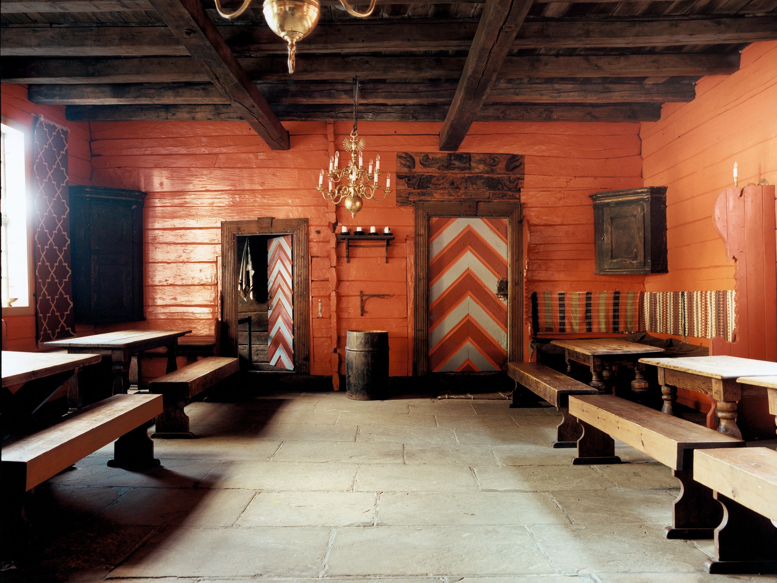 Image may contain Chandelier Lamp Floor Flooring Indoors Interior Design Wood Architecture Building and Dining Room